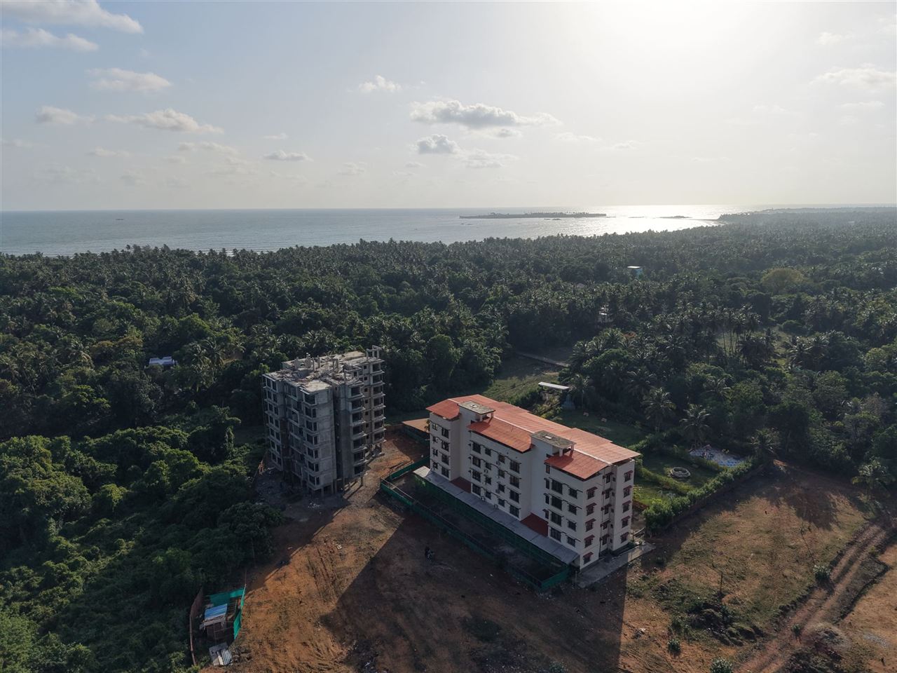 Aerial view of Horizon Grande by Metric Homes — sea-facing residences under construction near Tarkarli beach, Konkan coast